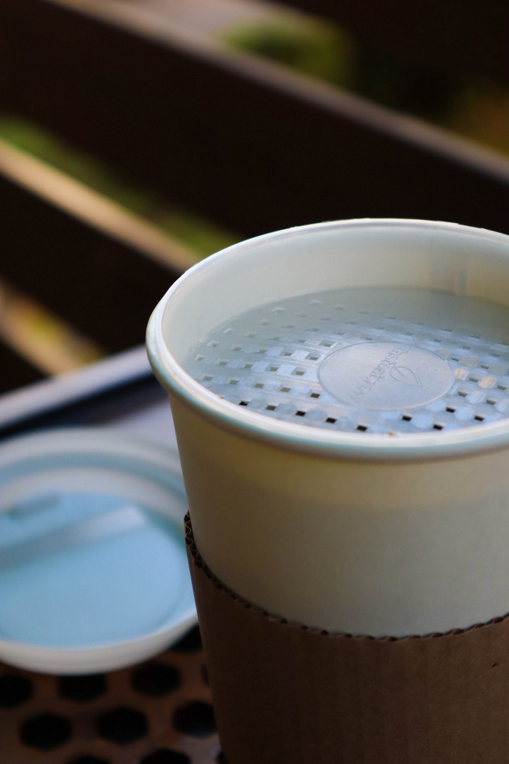 Tea to go in a glass with a strainer