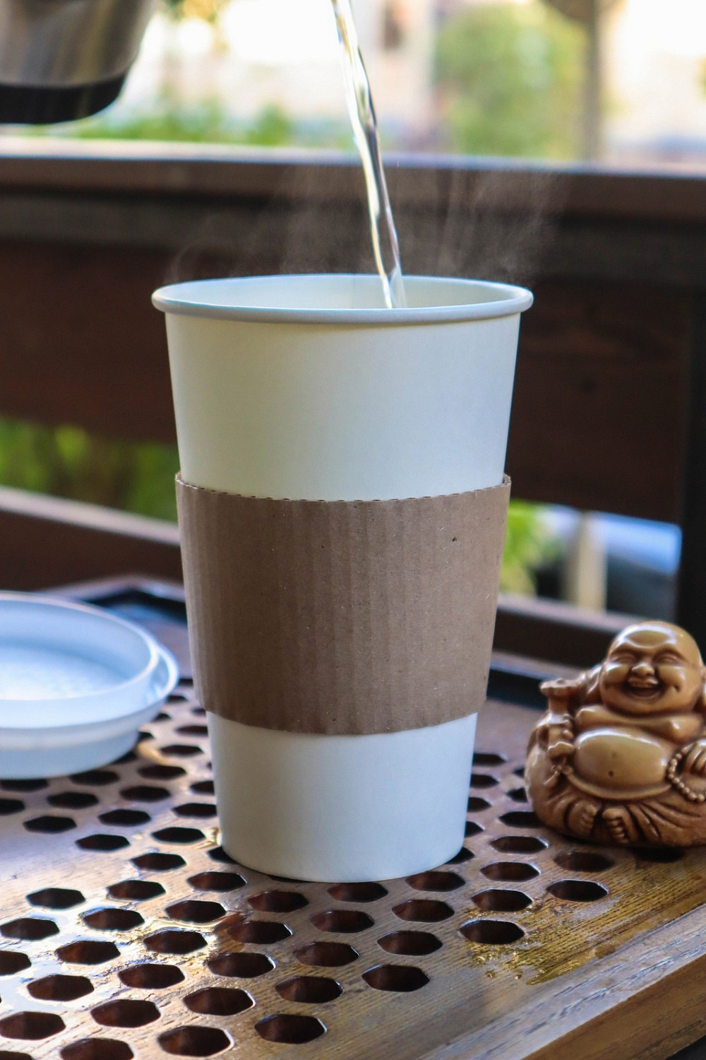 Tea to go in a glass with a strainer